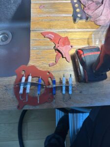 Professional plumbers performing annual boiler checks